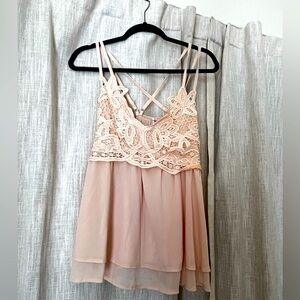 Very pretty apricot tank top with criss cross back.